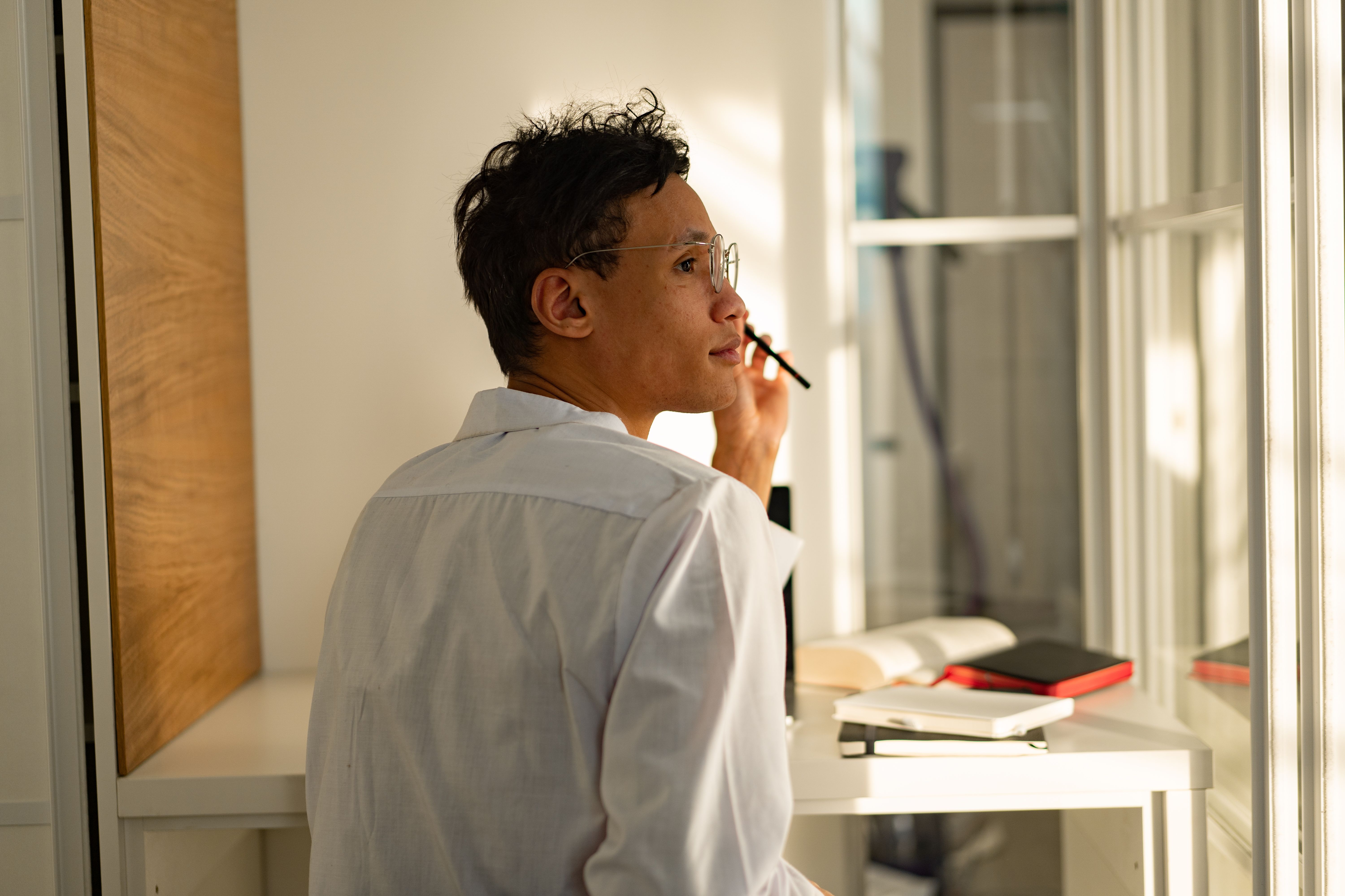 Student studying by a sunlit window